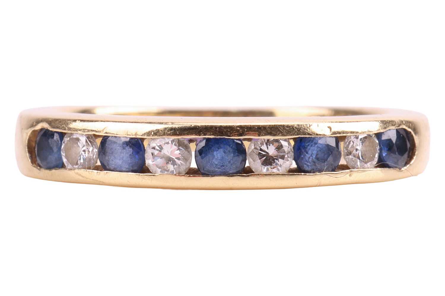 Lot A sapphire and diamond half eternity ring,...