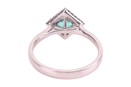 Lot An emerald and diamond ring, featuring a...