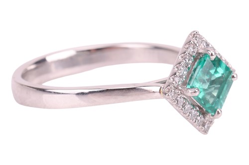 Lot An emerald and diamond ring, featuring a...