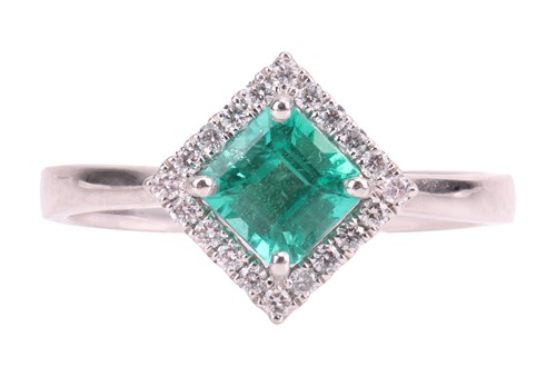 Lot An emerald and diamond ring, featuring a...