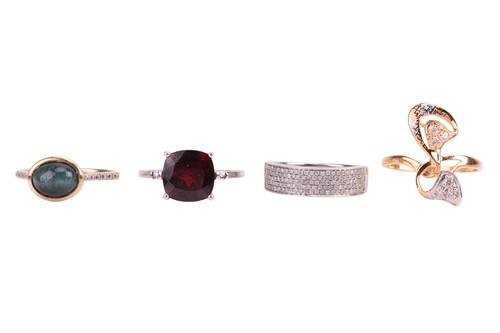 Lot 66 - Four gem-set rings; to include, a garnet and...