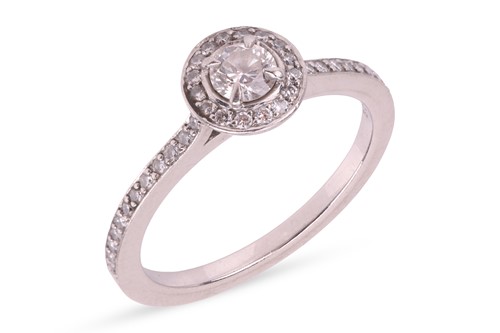 Lot Boodles - A diamond halo ring, claw-set with a...
