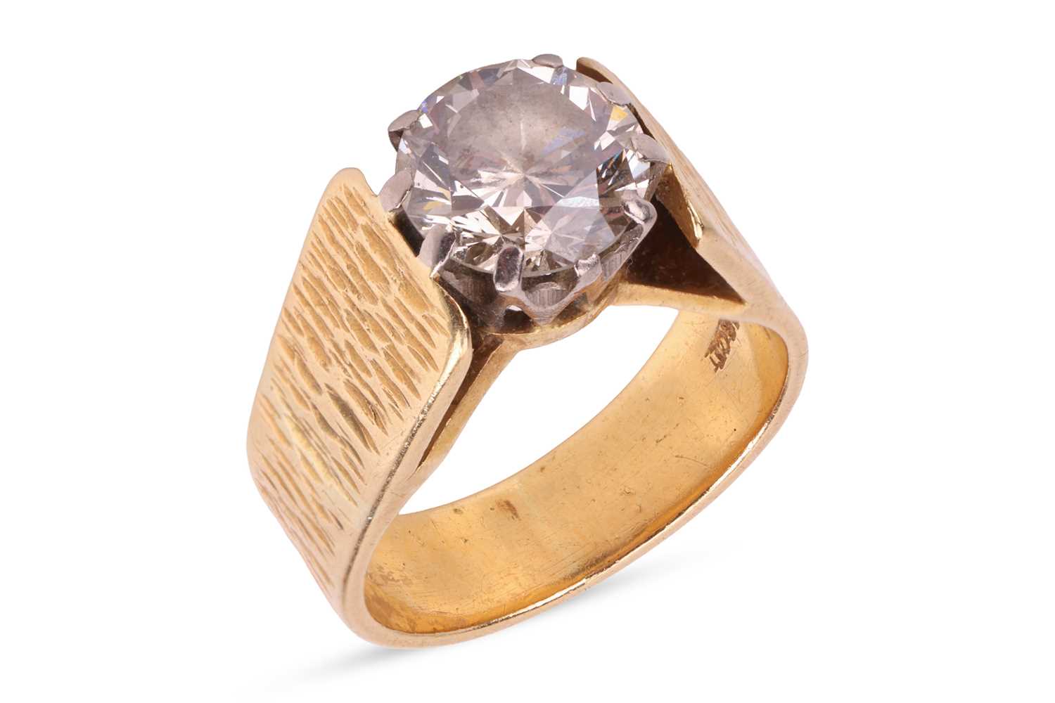 Lot A single stone diamond ring, featuring a round...