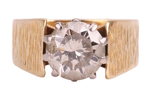 Lot A single stone diamond ring, featuring a round...