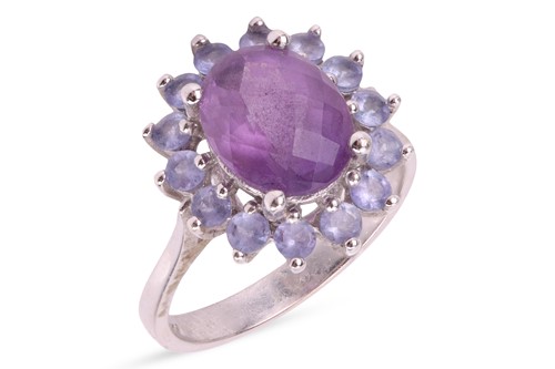 Lot An amethyst and tanzanite cluster ring, with a...