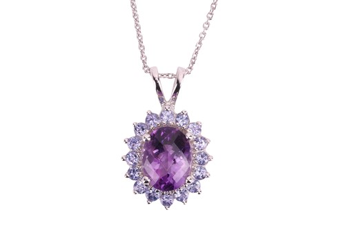 Lot An amethyst and tanzanite cluster pendant,...