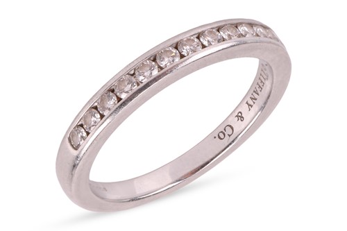 Lot Tiffany & Co - A diamond half-eternity ring,...
