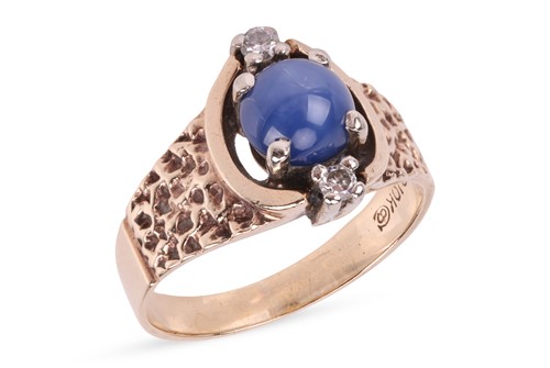 Lot 79 - A synthetic star sapphire and diamond-set ring,...