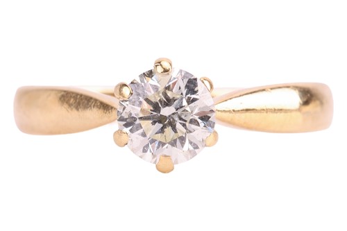 Lot A diamond solitaire ring, featuring a claw-set...