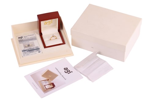 Lot A diamond solitaire ring, featuring a claw-set...