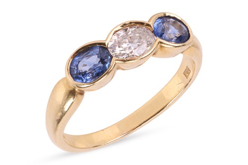 Lot A sapphire and diamond ring, featuring a...