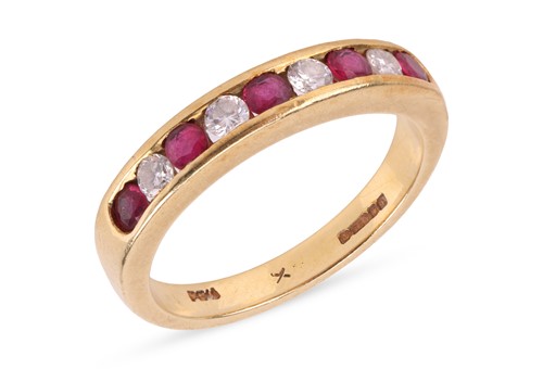 Lot A ruby and diamond half eternity ring,...