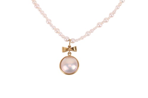 Lot 95 - A cultured pearl necklace and pendant, the...