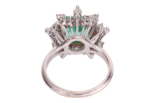 Lot 103 - An emerald & diamond cluster ring, the ring...