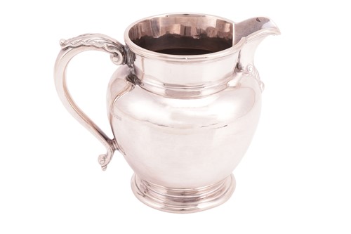 Lot 208 - An early 18th century style silver milk jug,...