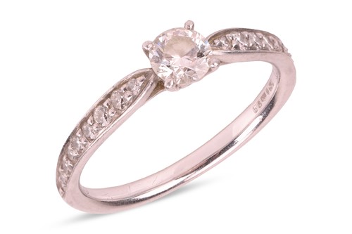 Lot 175 - Tiffany & Co. - A diamond engagement ring in...