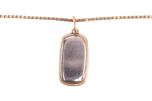 Lot 36 - A two-toned pendant on chain, together with a...