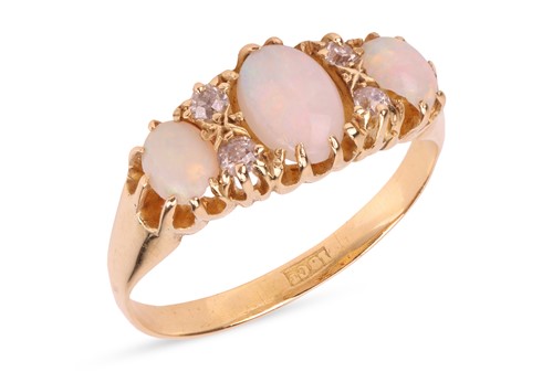 Lot 3 - An opal and diamond dress ring, comprising...