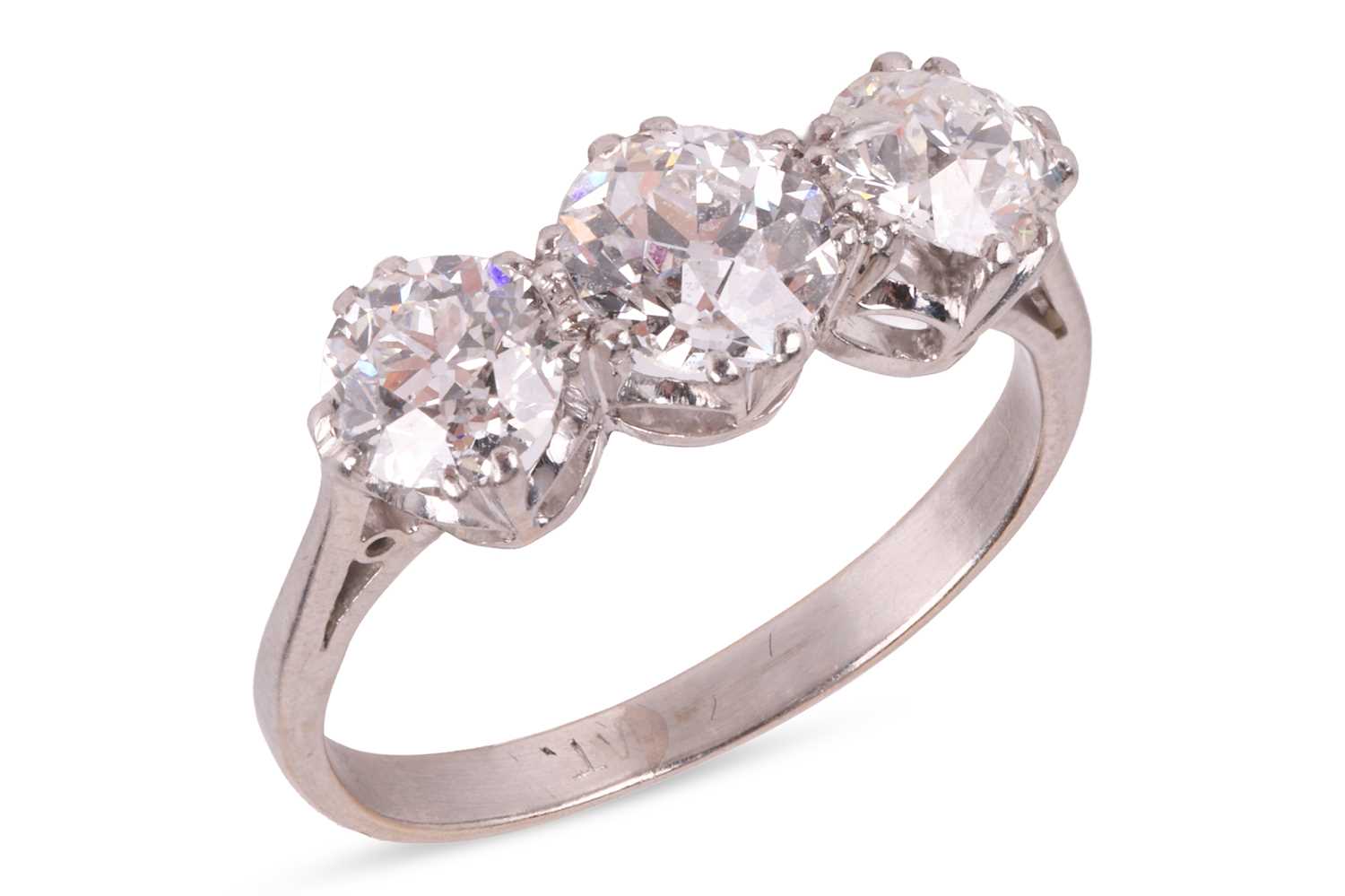 Lot An old-European cut diamond trilogy ring,...
