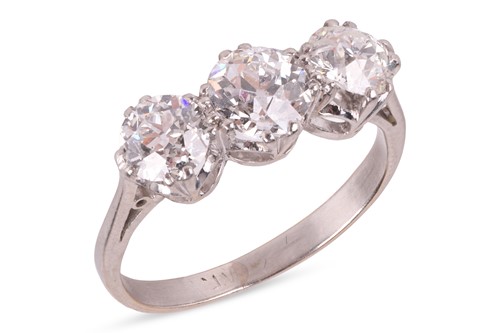 Lot An old-European cut diamond trilogy ring,...