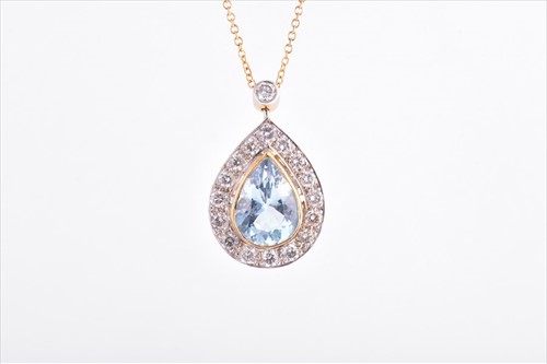 Lot 702 - A yellow gold, diamond, and aquamarine pendant...