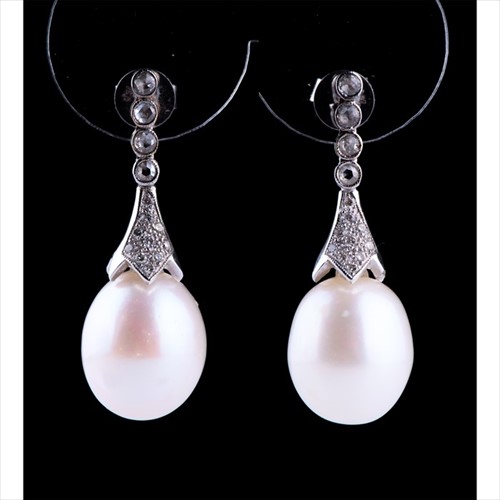 Lot 538 - A pair of pearl and diamond drop earrings each...