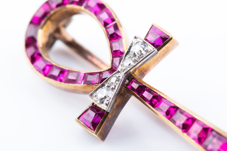 Lot 504 - A 20th century yellow metal and ruby 'Key of