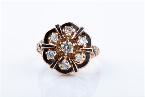 Lot 501 - A yellow metal, diamond, and black enamel...