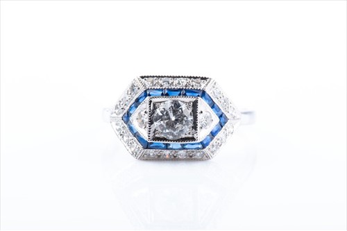 Lot 509 - A diamond and sapphire ring in the Art Deco...